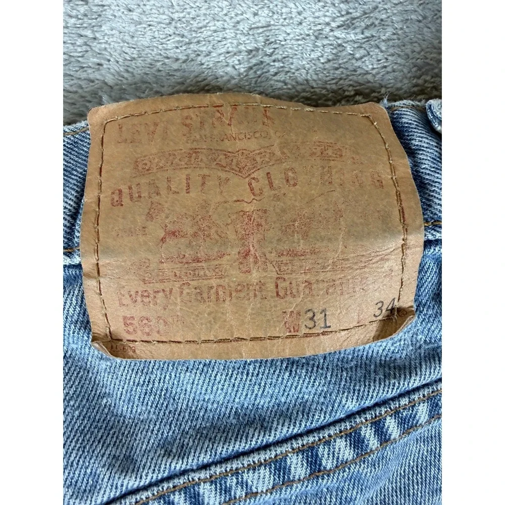 Vtg Levi's 560‎ Loose Taper Jeans W31 L34 Light Wash 90s Distressed Grunge